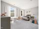 Bright bedroom with natural light, neutral walls, carpet, and stylish furnishings creating a cozy space at 5505 Crabtree Park Ct, Raleigh, NC 27612