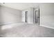 Spacious bedroom with neutral carpet, closet, and ensuite bath, perfect for relaxation and comfort at 5505 Crabtree Park Ct, Raleigh, NC 27612