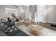 Cozy living room with open floor plan, hardwood floors, and natural light, leading to the staircase at 5505 Crabtree Park Ct, Raleigh, NC 27612