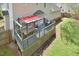 Backyard deck featuring a pergola, grill, and seating area for outdoor gatherings and comfortable living at 600 Old Farm Rd Rd, Graham, NC 27253