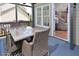 Outdoor deck featuring an outdoor table with 4 chairs on a covered patio area at 600 Old Farm Rd Rd, Graham, NC 27253