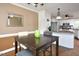 Dining area next to the kitchen and featuring hardwood floors and a dining table at 600 Old Farm Rd Rd, Graham, NC 27253