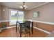 Dining area with hard wood floors, modern lighting, and lots of light at 600 Old Farm Rd Rd, Graham, NC 27253