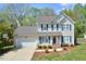 Charming two-story home with well-manicured lawn, attached garage, and inviting curb appeal at 600 Old Farm Rd Rd, Graham, NC 27253