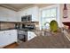 Beautiful kitchen with stainless steel appliances, white cabinetry, and modern countertops at 600 Old Farm Rd Rd, Graham, NC 27253
