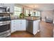 Open kitchen with stainless steel appliances and a view into the living room at 600 Old Farm Rd Rd, Graham, NC 27253