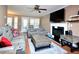 Cozy living room features a fireplace, comfortable seating, and natural light from the french doors at 600 Old Farm Rd Rd, Graham, NC 27253