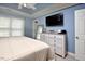 Relaxing main bedroom with trey ceilings, dresser, and large windows at 600 Old Farm Rd Rd, Graham, NC 27253