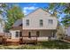 Backyard featuring a wooden deck and lush lawn, offering a private and inviting outdoor space at 613 Holly Thorn, Holly Springs, NC 27540