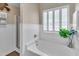 Soaking tub in bathroom with a separate shower at 613 Holly Thorn, Holly Springs, NC 27540
