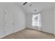 Cozy bedroom with a vaulted ceiling, neutral carpet, and a bright window at 613 Holly Thorn, Holly Springs, NC 27540