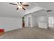 Neutral-colored bonus room featuring a ceiling fan, carpet, and access to a bathroom at 613 Holly Thorn, Holly Springs, NC 27540