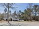 Community clubhouse and pool surrounded by mature trees, offering residents leisure and recreation opportunities at 613 Holly Thorn, Holly Springs, NC 27540