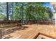 A large wooden deck offers an inviting space for outdoor relaxation and entertaining in a private backyard at 613 Holly Thorn, Holly Springs, NC 27540
