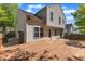 The wooden deck extends outdoor living with space for dining and lounging with views of the landscaped backyard at 613 Holly Thorn, Holly Springs, NC 27540