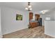 Eat-in kitchen with stainless steel appliances, wooden cabinets and sleek granite countertops at 613 Holly Thorn, Holly Springs, NC 27540