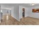 Spacious living room featuring hardwood floors, ample natural light, and freshly painted walls at 613 Holly Thorn, Holly Springs, NC 27540