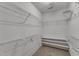 Walk-in closet with wire shelving and neutral carpet at 613 Holly Thorn, Holly Springs, NC 27540