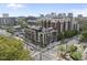 This aerial view showcases a modern mid-rise with multiple stories, balconies and city views at 615 W Peace St # 201, Raleigh, NC 27605