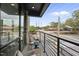 Relaxing balcony space with seating, overlooking vibrant city streets and nearby buildings at 615 W Peace St # 201, Raleigh, NC 27605
