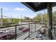 Charming balcony with outdoor furniture, offering elevated views of the neighborhood and city streets at 615 W Peace St # 201, Raleigh, NC 27605