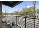 Cozy balcony with seating area, offering scenic views of the neighborhood and street below at 615 W Peace St # 201, Raleigh, NC 27605
