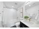 Modern bathroom with sleek fixtures, bathtub with shower, and contemporary design at 615 W Peace St # 201, Raleigh, NC 27605