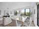 Inviting dining area with modern table and chairs, filled with natural light and open to living space at 615 W Peace St # 201, Raleigh, NC 27605