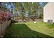Grassy backyard, with privacy fence and mature trees providing seclusion at 616 Branchview Dr, Durham, NC 27713