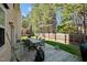 Spacious wooden deck with outdoor seating and grill, overlooking the fenced backyard at 616 Branchview Dr, Durham, NC 27713