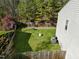 Well-maintained backyard with mature trees and privacy fence at 616 Branchview Dr, Durham, NC 27713