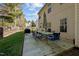 A house's backyard includes a deck, lawn, and grill; surrounded by a wooden fence at 616 Branchview Dr, Durham, NC 27713
