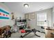 Well-lit bedroom with a large window, a desk with dual monitors, and exercise equipment at 616 Branchview Dr, Durham, NC 27713