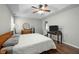 Well-lit primary bedroom featuring a ceiling fan and wood flooring at 616 Branchview Dr, Durham, NC 27713