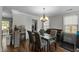 Dining room featuring a modern table, piano and bright window at 616 Branchview Dr, Durham, NC 27713