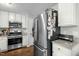 Well-lit kitchen with stainless steel appliances and white cabinets for a clean, modern look at 616 Branchview Dr, Durham, NC 27713