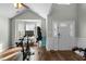 Bright living room with vaulted ceiling and front door with decorative glass sidelights at 616 Branchview Dr, Durham, NC 27713