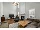 Spacious living room with fireplace and large windows offering plenty of natural light at 616 Branchview Dr, Durham, NC 27713