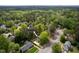 An aerial view of a charming home nestled in a lush, mature neighborhood with easy access to nearby amenities at 6216 Valley Estates Dr, Raleigh, NC 27612