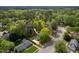 An aerial view of a beautiful, well-maintained home nestled among mature trees and lush landscaping at 6216 Valley Estates Dr, Raleigh, NC 27612
