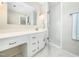 Bathroom features a white vanity with plenty of storage space, a glass shower, and a large mirror at 6216 Valley Estates Dr, Raleigh, NC 27612