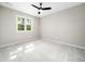 Spacious bedroom with a window and a ceiling fan at 6216 Valley Estates Dr, Raleigh, NC 27612