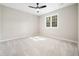 A spacious bedroom features neutral walls and carpet at 6216 Valley Estates Dr, Raleigh, NC 27612