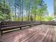 A spacious wooden deck overlooks a beautiful wooded area at 6216 Valley Estates Dr, Raleigh, NC 27612