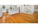 Spacious kitchen with island, stainless steel appliances, stairs, and sleek cabinetry blending style and function at 6216 Valley Estates Dr, Raleigh, NC 27612