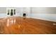 Open living space with wood floors, a fireplace, built-in shelving, and a sliding glass door at 6216 Valley Estates Dr, Raleigh, NC 27612
