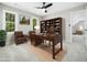 Home office with a large desk, a bookshelf, and two chairs at 6216 Valley Estates Dr, Raleigh, NC 27612