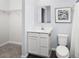 Neat bathroom featuring a functional vanity, ample lighting, and a neutral color palette at 634 Silverado Sunset Loop, Wendell, NC 27591