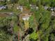 Aerial view of home with large lot surrounded by mature trees in a quiet neighborhood at 7221 Messenger Dr, Willow Springs, NC 27592