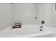 Stylish bathroom featuring a soaking tub, chrome hardware, and light gray walls at 7221 Messenger Dr, Willow Springs, NC 27592